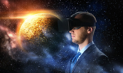 Image showing businessman in virtual reality headset over space