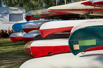 Image showing Canoes in a camp