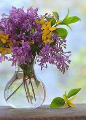 Image showing Lilac bouquet on the wooden table