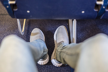 Image showing Airplane seats with more leg space for comfortable flight.