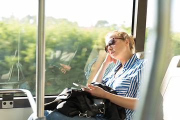 Image showing Portrait of tired woman sleeping on bus.