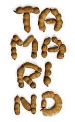 Image showing Word tamarind made of tamarind fruits. Top view  