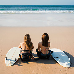 Image showing Surfer girls at the beach 