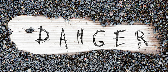 Image showing Sand on planked wood - Danger