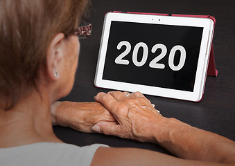 Image showing Senior lady relaxing and her tablet - 2020