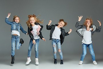 Image showing Young girl jumping at studio