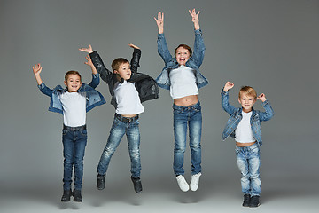 Image showing Young boys jumping at studio