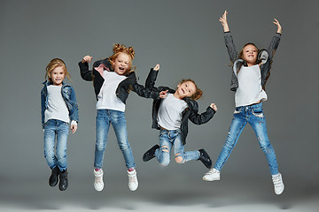 Image showing Young girl jumping at studio