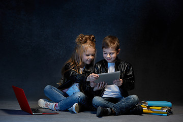 Image showing Studio shot of two children with laptop