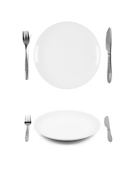 Image showing White plates with fork and knife