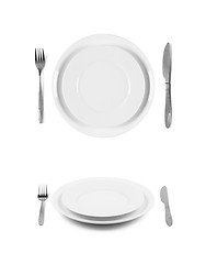 Image showing Two white plates with fork and knife