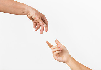 Image showing close up of senior and young woman hands