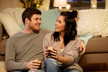 Image showing happy couple drinking coffee and eating at home