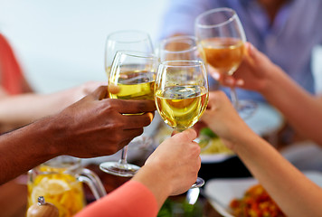 Image showing hands clinking wine glasses