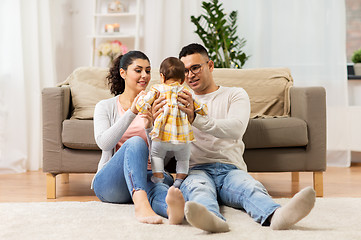 Image showing happy family with baby daughter at home