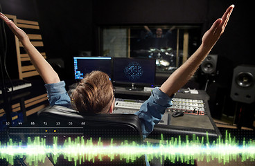 Image showing man at mixing console in music recording studio