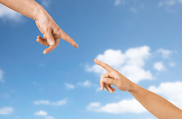 Image showing close up of senior and young woman hands