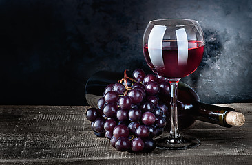 Image showing Wine with grapes and bottle