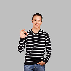 Image showing Asian Man In Striped Pullover