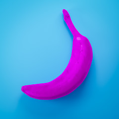 Image showing a pink banana on turquoise background