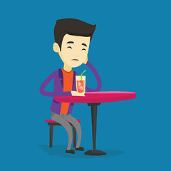 Image showing Man drinking cocktail at the bar.