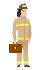 Image showing Caucasian firefighter holding briefcase.