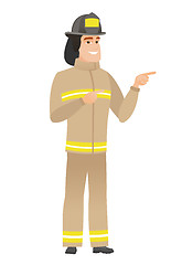 Image showing Young caucasian firefighter pointing to the side.