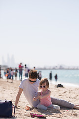 Image showing Mom and daughter on the beach