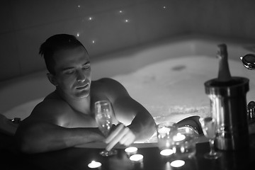 Image showing man relaxing in the jacuzzi