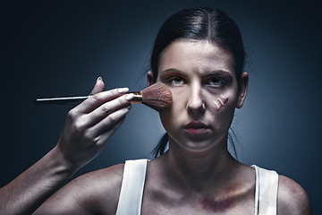 Image showing Close up portrait of a crying woman with bruised skin and black eyes