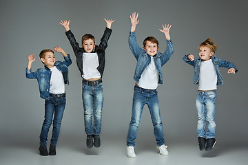 Image showing Young boys jumping at studio