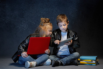 Image showing Studio shot of two children with laptop