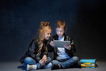 Image showing Studio shot of two children with laptop