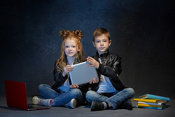 Image showing Studio shot of two children with laptop