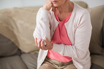 Image showing close up of senior woman having hand ache at home