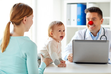 Image showing baby with mother at doctor on red nose day