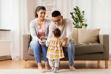 Image showing happy family with baby daughter at home