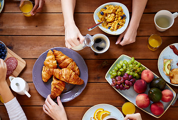 Image showing group of people having breakfast at table