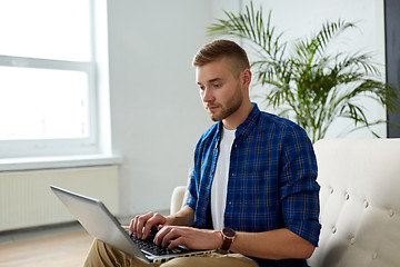 Image showing man with laptop working at office