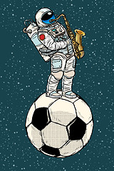 Image showing Astronaut plays saxophone on a football soccer ball