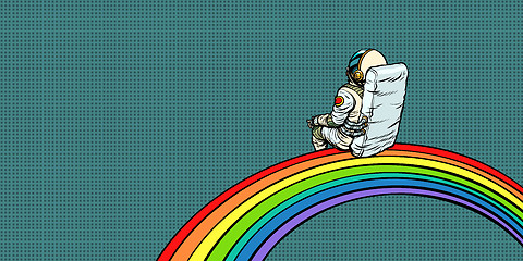 Image showing astronaut sits on a rainbow