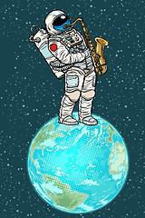 Image showing Astronaut plays saxophone on planet earth