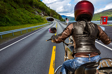 Image showing Biker girl First-person view, mountain serpentine.