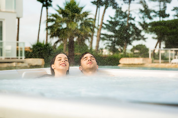 Image showing Young couple in a jacuzzi