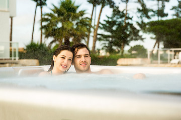 Image showing Young couple in a jacuzzi