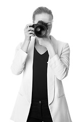 Image showing Beautiful young photographer with camera in professional studio