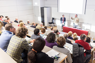 Image showing Business speaker giving a talk at business conference event.