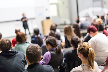 Image showing Woman giving presentation in lecture hall at university.