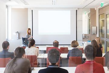 Image showing Woman giving presentation in lecture hall at university.