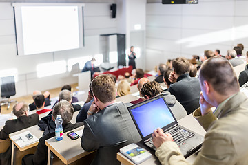 Image showing Business speaker giving a talk at business conference event.